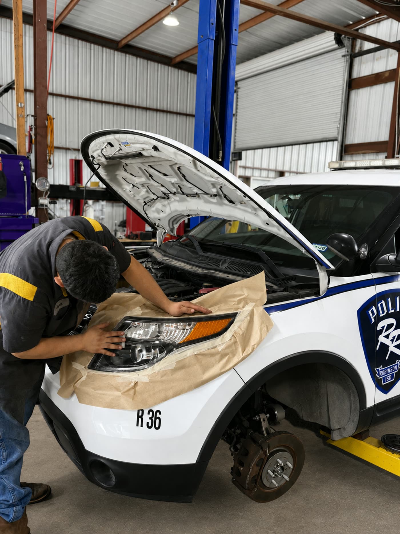 Headlight lens before and after restoration at Quality Mechanics — after